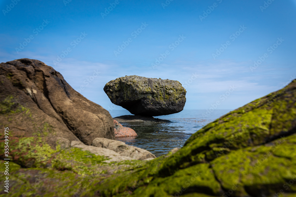 Balance Rock, a popular and famous attraction near the village of Skidegate in Haida Gwaii (formerly Queen Charlotte Islands), British Columbia, Canada. Balance Rock, a popular and famous attraction near the village of Skidegate in Haida Gwaii (formerly Queen Charlotte Islands), British Columbia, Canada.