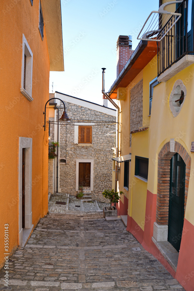 A narrow street between the old houses of Fragneto l'Abate, a medieval village in the Campania region.