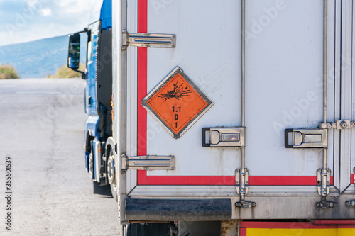 Fotografie, Obraz Truck transporting explosives, danger label according to the ADR identifies explosives in the transport of dangerous goods