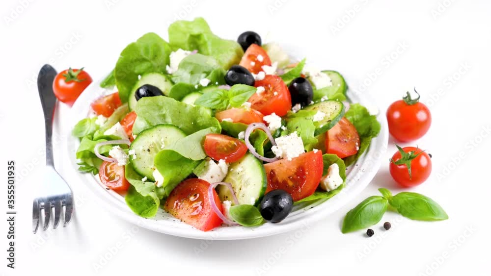 greek salad with feta cheese, tomato, olive, cucumber and lettuce greek salad with feta cheese, tomato, olive, cucumber and lettuce