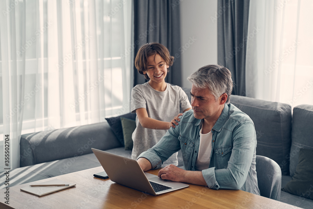 Son and father spending time at home Son and father spending time at home