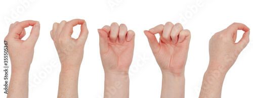 Freckled white hand. Various isolated views of a woman's hand, using fingers make a pinching or pen holding gesture.  Collection set