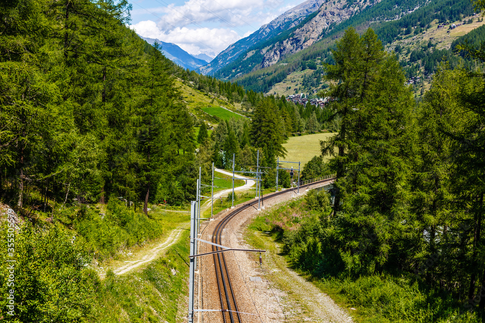 Swiss mountain train crossed Alps, railway in the mountains