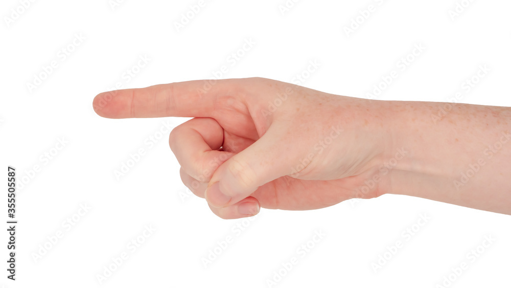 Freckled white hand. Isolated woman's hand in a pointing gesture with the thumb crossing the palm and depressing the other fingers Freckled white hand. Isolated woman's hand in a pointing gesture with the thumb crossing the palm and depressing the other fingers