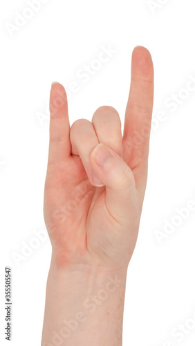 Freckled white hand. Isolated woman's hand in a horns gesture palm up, middle and ring fingers tucked into the palm by the thumb, index and little fingers extended photo