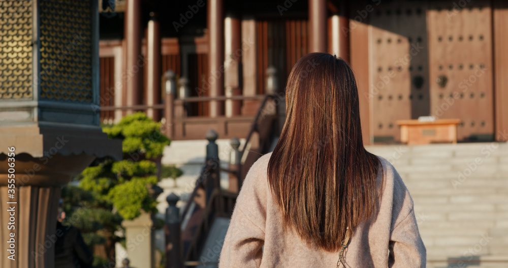 Woman visit traditional Chinese temple