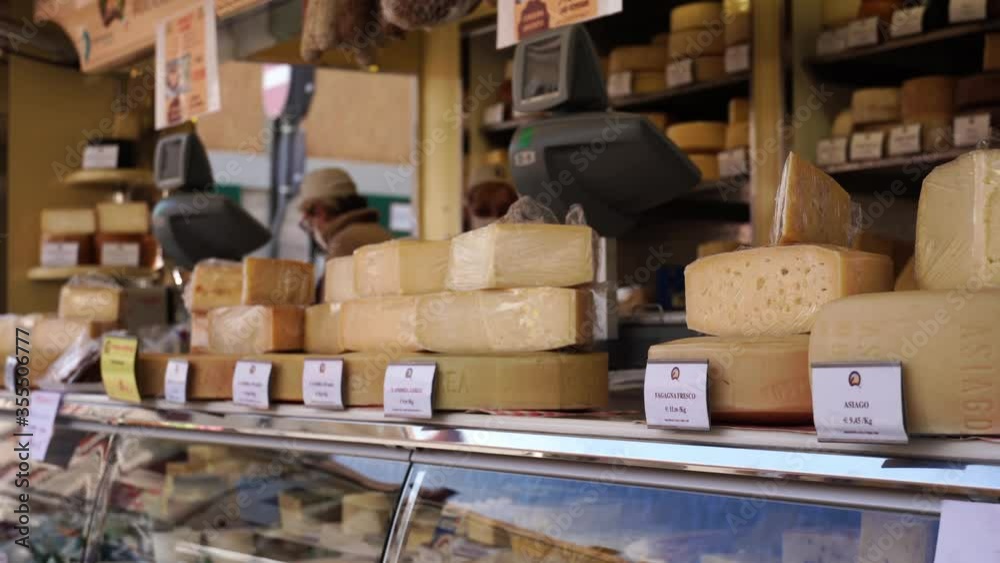 display of Italian cheeses in a marketplace display of Italian cheeses in a marketplace