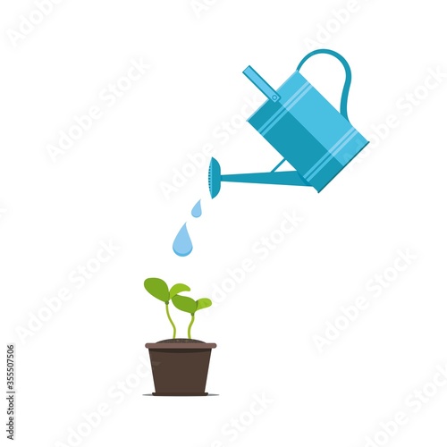 Watering seeds with watering can. Gardening and sowing design concept for germination.