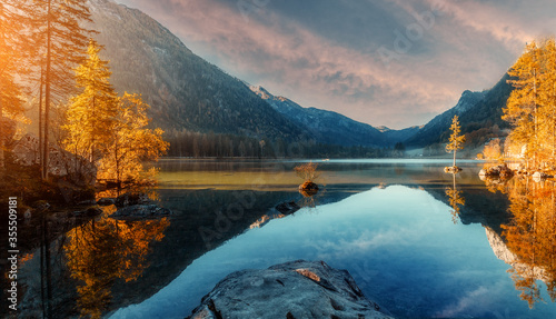 Wonderful Colorful Sunset at Hintersee Lake in Bavarian Alps. Awesome Alpine Highlands in sunny Day. Amazing Autumn Natural Background. Incredible Nature Landscape. Beautiful locations of the World