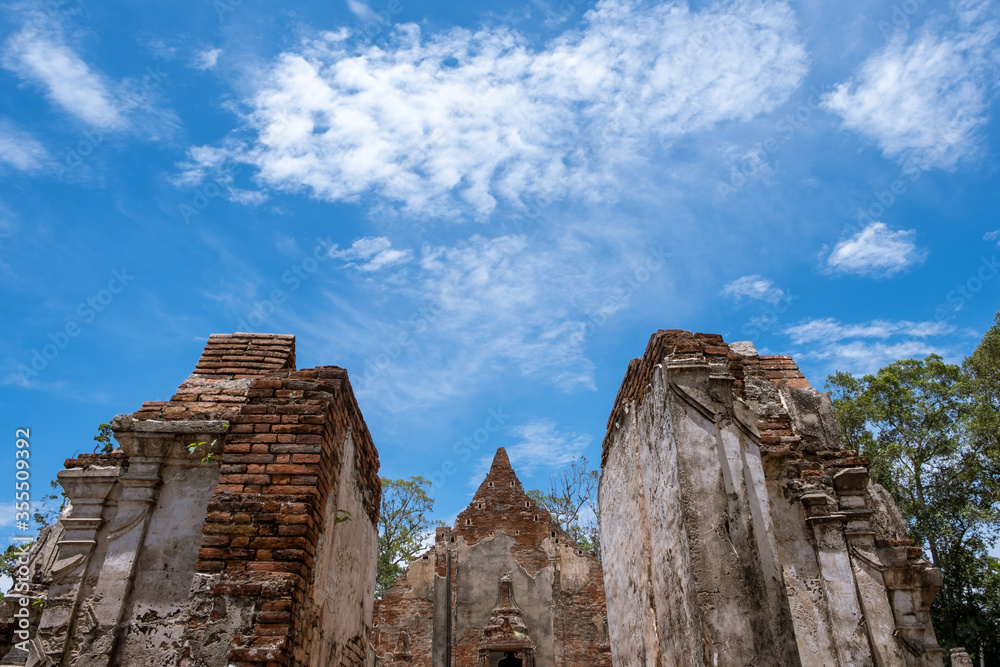 The ancient gates of the old temples in Thailand and the blue sky.