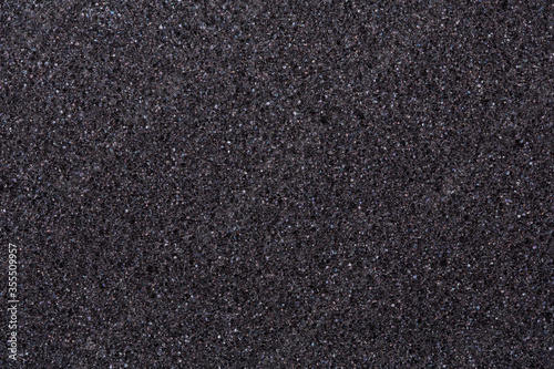 Texture of dark foam rubber closeup as background, idea