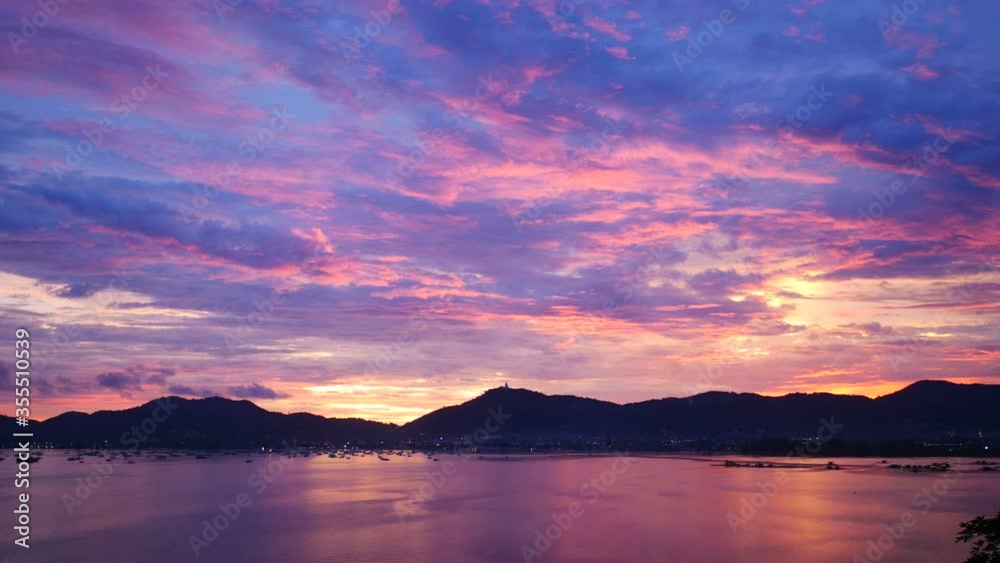 soft wave ripple with golden reflection, mountain long distance, colorful cloudy twilight sky background at sunset evening time soft wave ripple with golden reflection, mountain long distance, colorful cloudy twilight sky background at sunset evening time