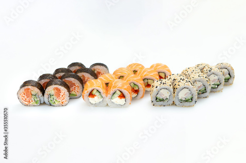 Sets of different sushi roles on a white background