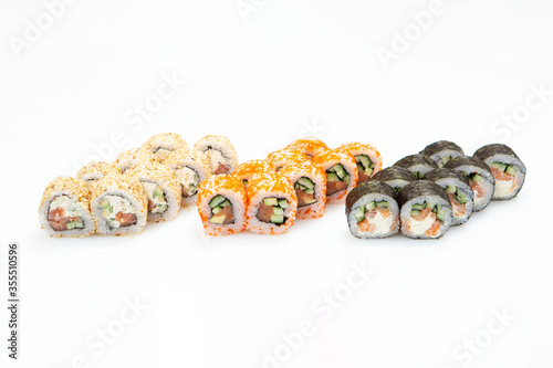 Sets of different sushi roles on a white background