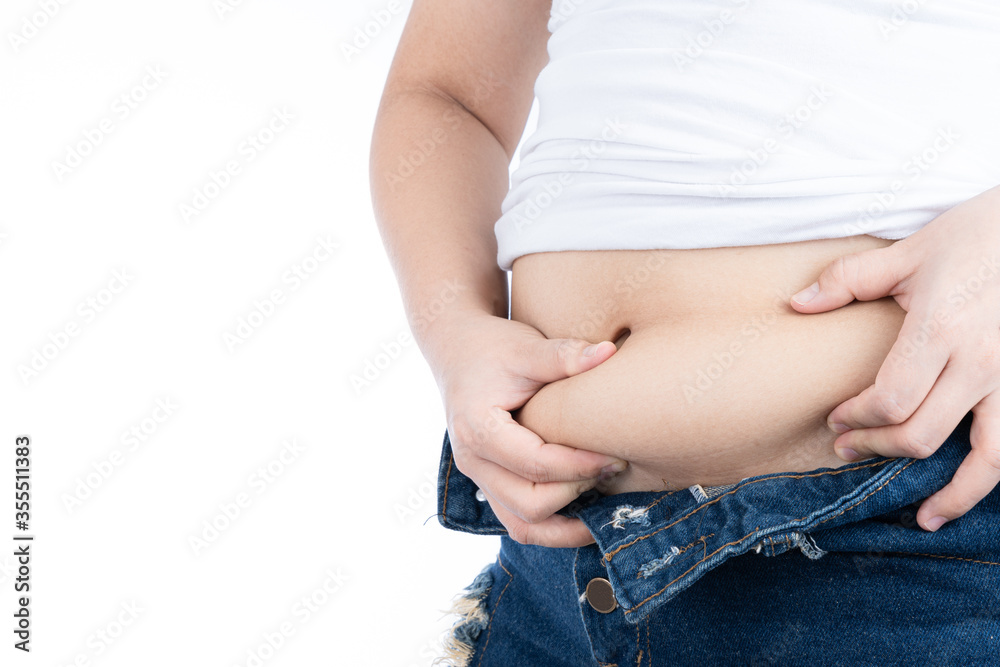 Fat woman holding excessive fat belly, overweight fatty belly isolated on over white background. Diet lifestyle, weight loss, stomach muscle, healthy concept. Fat woman holding excessive fat belly, overweight fatty belly isolated on over white background. Diet lifestyle, weight loss, stomach muscle, healthy concept.