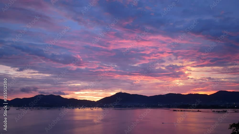 soft wave ripple with golden reflection, mountain long distance, colorful cloudy twilight sky background at sunset evening time soft wave ripple with golden reflection, mountain long distance, colorful cloudy twilight sky background at sunset evening time