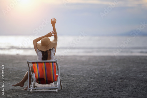 Happy Carefree Woman Enjoying Beautiful Sunset on the Beach,young slim beautiful woman on sunset beach