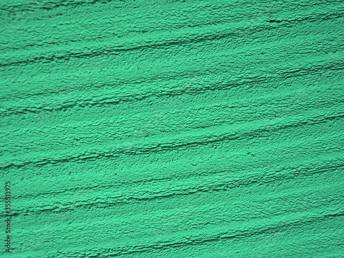 turquoise embossed stripe background, green seamless abstract wall surface, 3D effect.