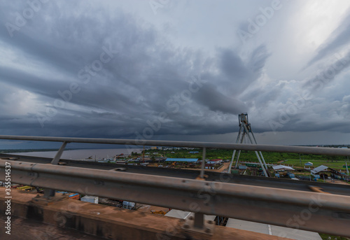 Cloudy Sky Scenery From The Jules Wijdenbosch Bridge Over The Suriname River Between The Capital City Paramaribo And Meerzorg In The Commewijne District. photo