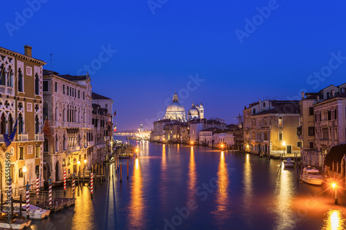 View of Venice Grand Canal and Santa Maria della Salute church in evening. © Irina Ermakova