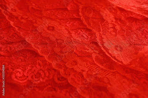Red background from red scarlet lace guipure for sewing and decoration