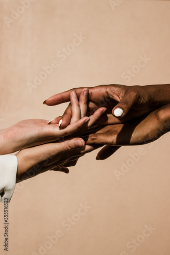 white and black people holding hands