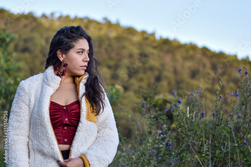 Model Woman poses in nature