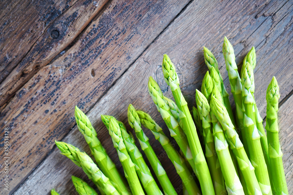 Fototapeta premium Asparagus stack close up on the wooden table