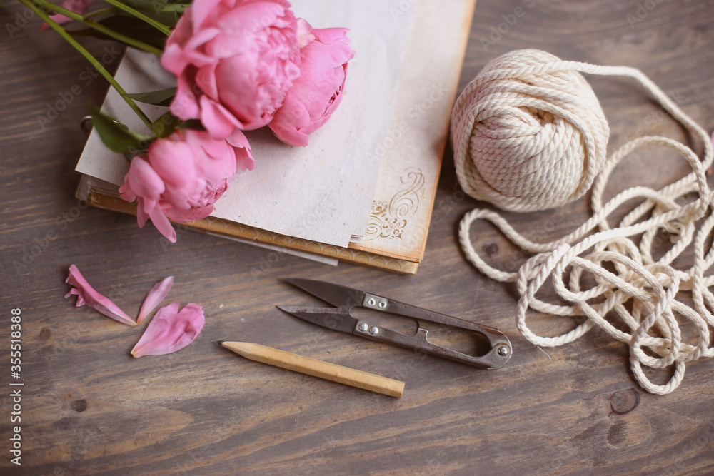 Floral frame with pink peonies on wooden background. Mothers day.