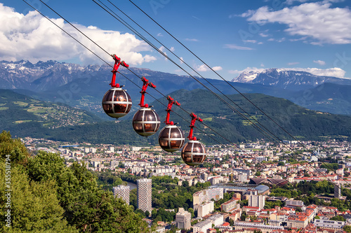 Picturesque aerial view on cable way and city. Grenoble, France. Grenoble-Bastille cable car on the foreground