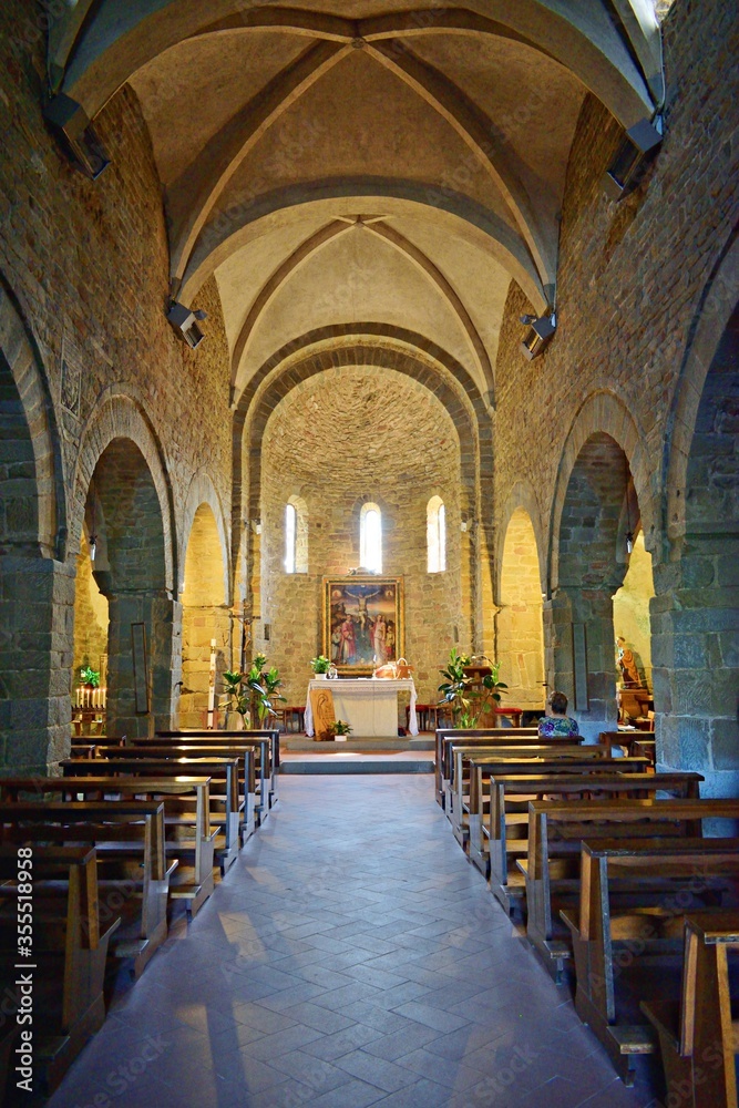 The interior of the beautiful church of Santa Maria and San Leonardo, divided into three naves covered by fourteenth-century cross vaults located at Artimino, Prato, Tuscany, Italy