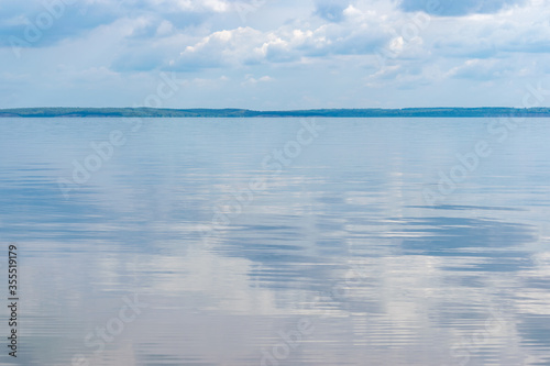 Landscape overlooking the sea, in the back with a bright blue sky © TehNoss