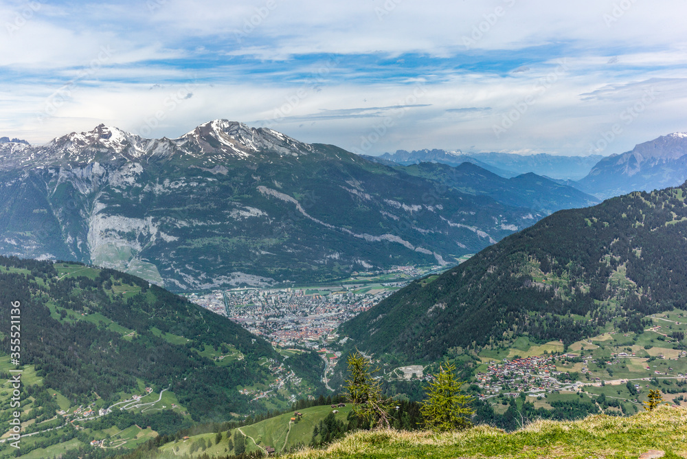 View of Chur, the town of the Alps in Switzerland, nested at the bottom of the valley