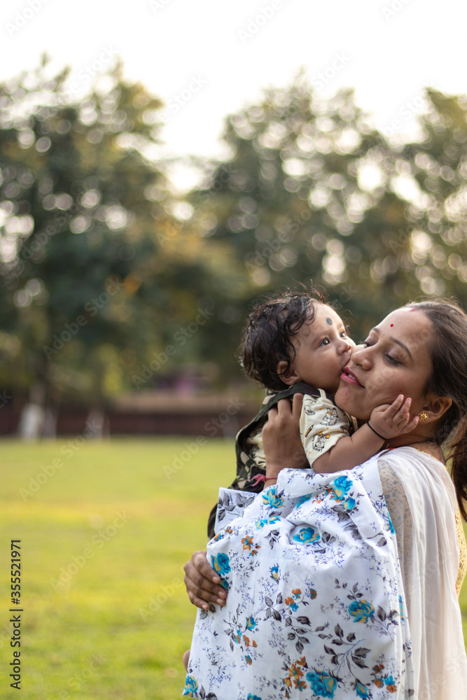 Fototapeta premium Happy loving family. Mother and her son playing, laughing, kissing and hugging.
