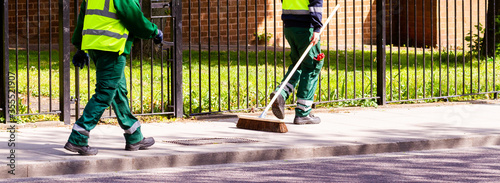 Obraz na plátne Street cleaners walking along in Hackney, London