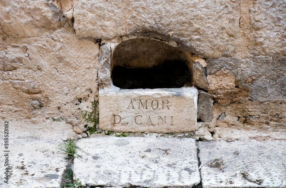 Watering point, hole, watering through, man-made for dogs and cats in old town Sibenik