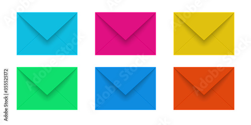 Set of mail envelopes of various colors on a white background.