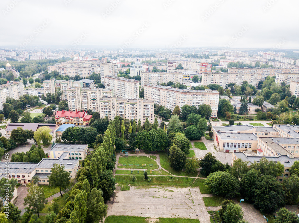 Aerial view of town with socialist soviet panel building at cloudy day. Buildings were built in the Soviet Union now Ukraine. The architecture looks like most post-soviet commuter towns.