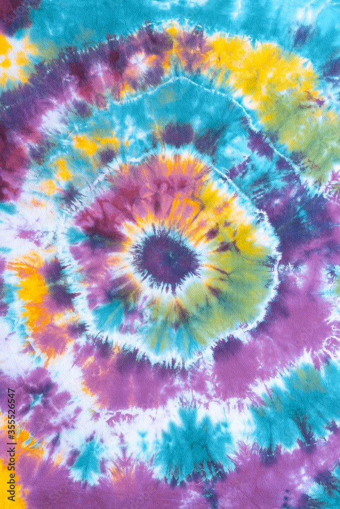 tie dye pattern hand dyed on cotton fabric abstract texture background. tie dye pattern hand dyed on cotton fabric abstract texture background.
