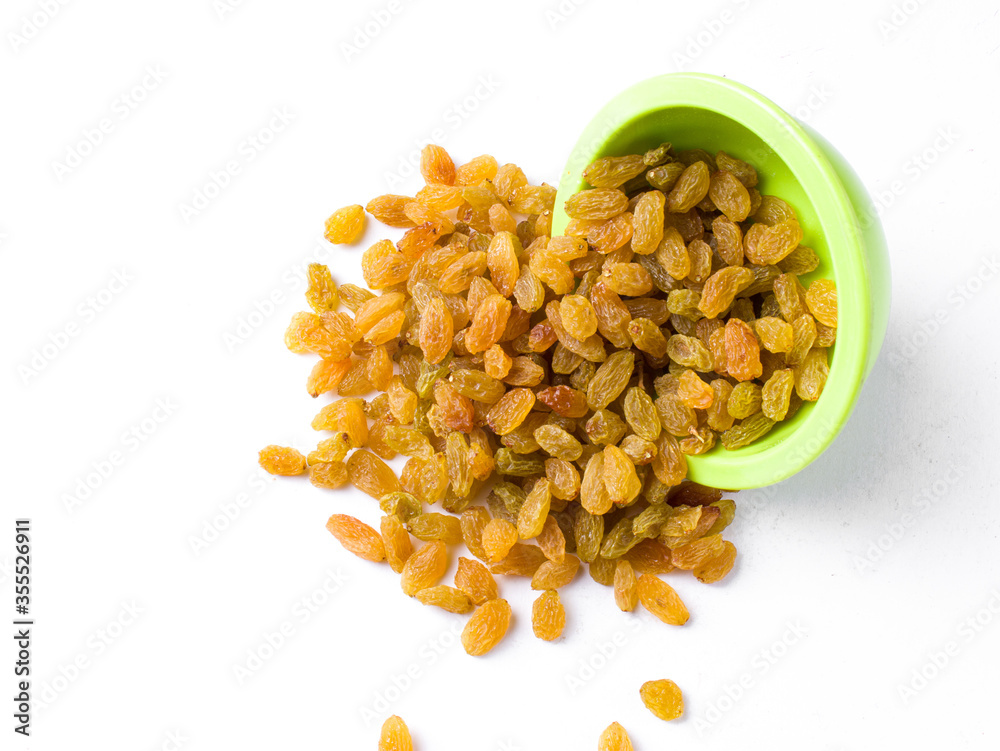 Fresh raisin in a green bowl with a white background.
Fresh raisin in a green bowl with a white background.