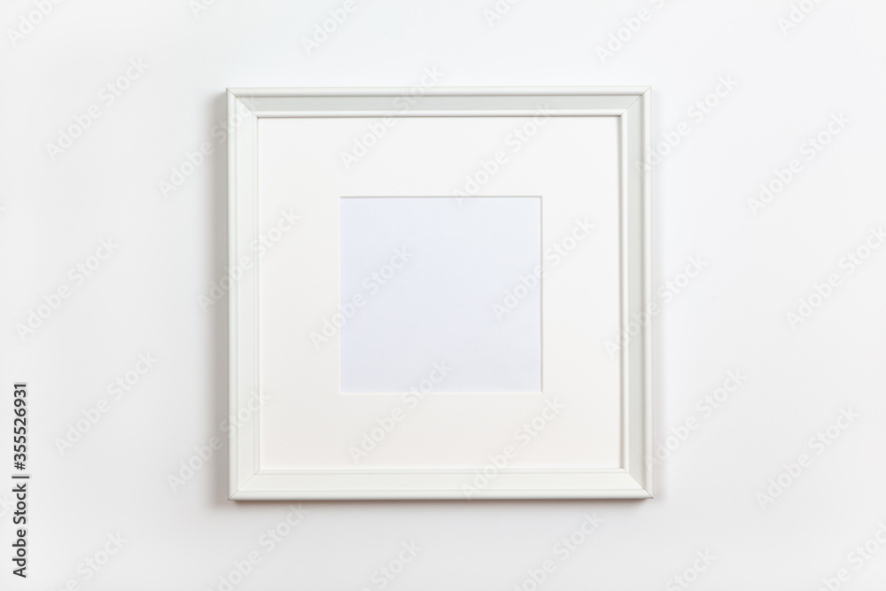 White clean square frame with passepartout on white background, copy space. Flat lay or side view, minimal style mock-up. For gift shop, social media, website design.