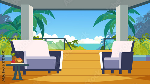 Furnished veranda in a tropical hotel. Rental housing in the journey to the sea. Terrace overlooking the sea, palm trees, fruits.