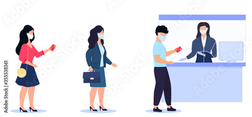 Social distancing and coronavirus covid-19 prevention. People in protective masks are waiting in the queue to the cashier of the bank