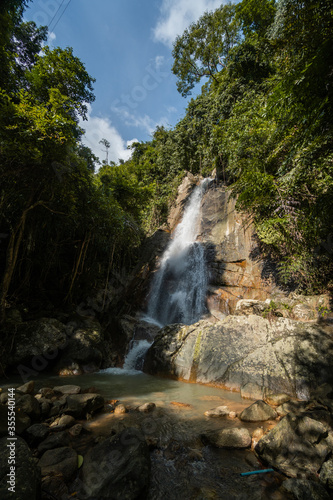 Secret tropical waterfall in jungle on a Samui island.