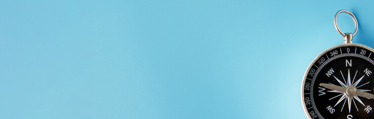 Banner of compass on blue background with copy space using as direction