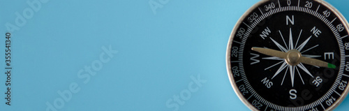 Banner of compass on blue background with copy space using as direction