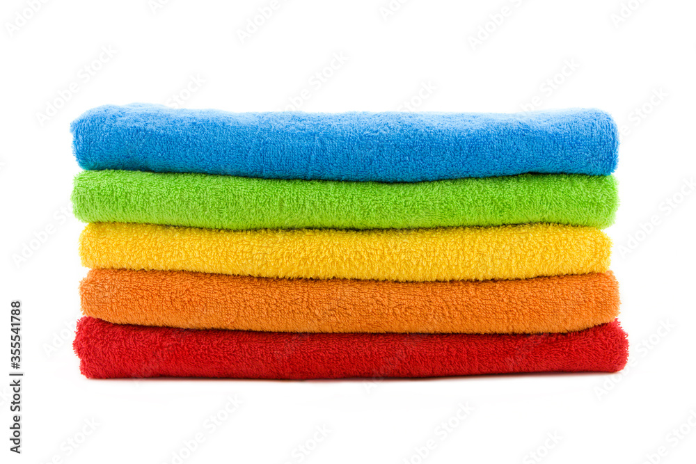 Stack of colorful bathroom towels isolated on white Stack of colorful bathroom towels isolated on white