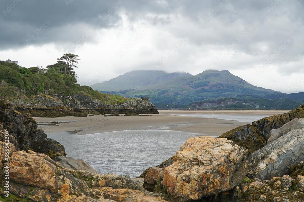The beach at Borth Y Gest on the banks of the Afon Dywryd looking towards the mountains of Snowdonia and Porthmadog