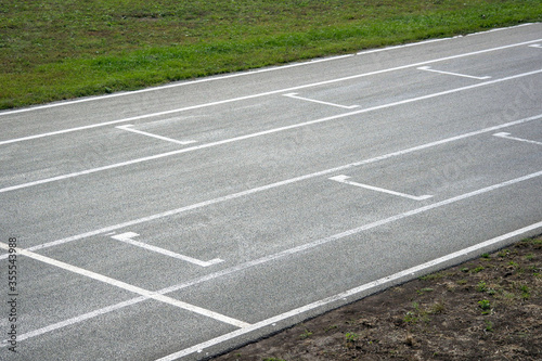 Close-up view of racing circuit track with starting grid