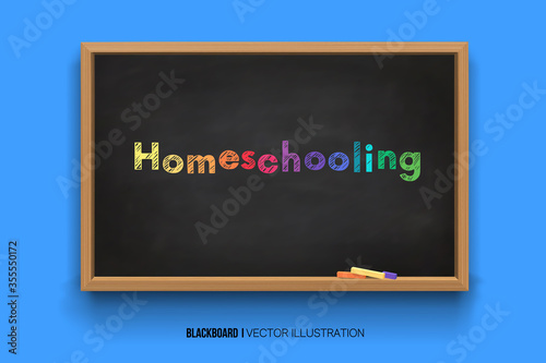 Homeschooling. Colorful Word.online learning. Chalk inscription on a blackboard. Chalkboard 3D. Realistic black boards in a wooden frame isolated on a blue background.